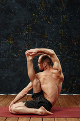 Naklejka premium Man practicing advanced yoga. A series of yoga poses. Sport concept