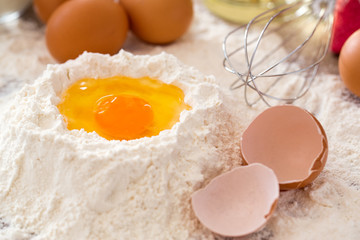 Baking ingredients -mixing egg and flour baking cakes.