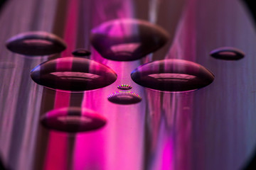 Soaking pixels. Small water droplets on a screen of a phone.

