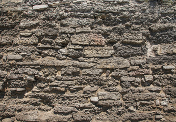 wall of rough stones as background