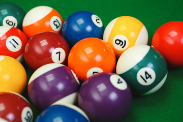 billiard balls on a green pool table, closeup