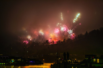 Fototapeta premium Big dramatic fireworks scene with green clouds and red fire