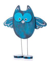 Funny wooden toy owl on a white