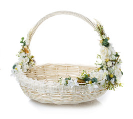 Fototapeta na wymiar basket with flowers to celebrate Easter on a white background