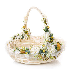Fototapeta na wymiar basket decorated with flowers isolated on white