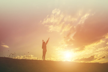 Fototapeta premium Young woman relaxing in summer sunset sky outdoor. People freedom style.