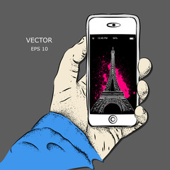 Smartphone in hand. Vector illustration of Eiffel Tower displayed on the phone screen. Abstract theme of travel