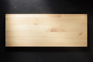 wooden board at black background