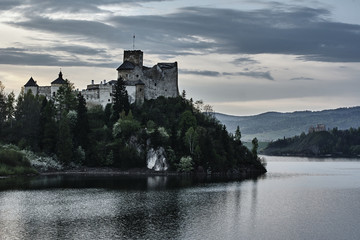 Castle and lake in Carpathian mountains, Poland.