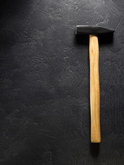 hammer tool at black background