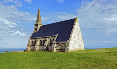 Fototapeta na wymiar View of a small chapel, Chapelle Notre Dame de la Garde, on the Alabaster Coast near Etretat in Normandy, France