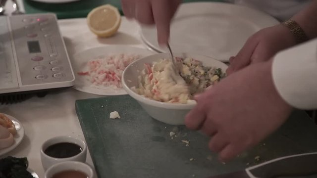 Cook cooking on a kitchen salad