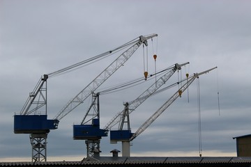 Cranes of a shipyard in the coastal town Haugesund, Norway, on the island Risoy. Scandinavia,...