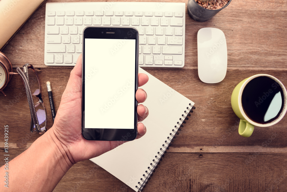 Aufkleber hand use smart phone with blank white screen top view