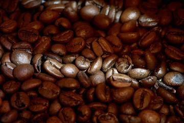 Background of Close up of fresh Roasted coffee beans in coffee bag