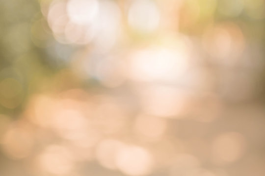 Abstract blurred circle bokeh in warm tone for Christmas or celebration  light holiday background.