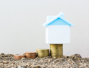 Saving to buy a house that stack  coin growing ,saving money or money growth concept