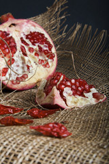 Ripe pomegranate on canvas background