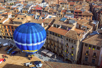 Fototapeta premium Hot air balloon launch on the main square of the historic Spanish city of Vic. Spain, province Barcelona