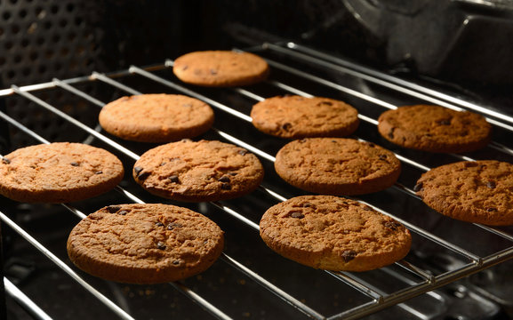 Chocolate Chip Cookies Baking In Home Oven.