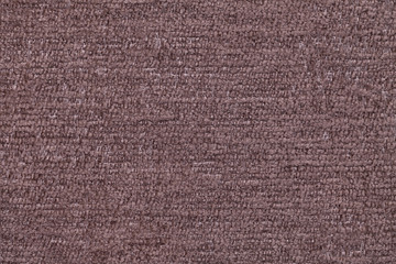 Brown fluffy background of soft, fleecy cloth. Texture of textile closeup