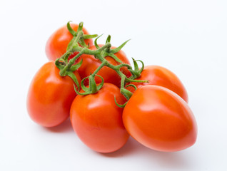 Close up red cherry tomato on white background isolated.