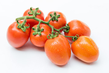 Close up red cherry tomato on white background isolated.