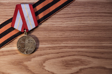 Medals of the Patriotic War in St. George's Ribbon on a wood background. 9 may