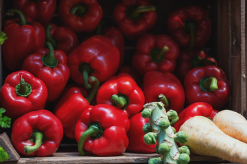 Red peppers in crates displayed on the food festival.