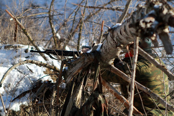 soldier or sniper holding gun