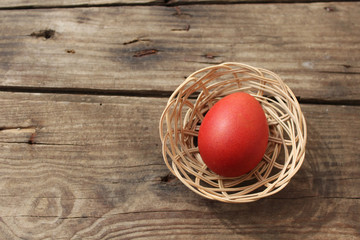 Easter egg on old wooden background with copy space 