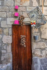 Image of an old shop door in a street in the center of Largentiere