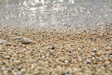 Fototapeta na wymiar Sandy stone background for summer. Sand beach texture