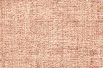 Light brown fluffy background of soft, fleecy cloth. Texture of textile closeup.