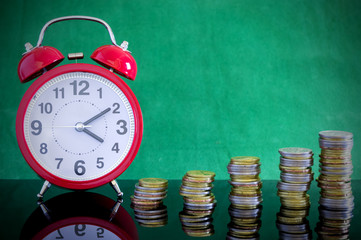 Coins and watch. Copy space concept for saving fund, financial, banking, investment, money or other...
