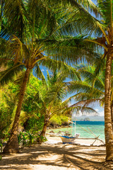 Naklejka na ściany i meble Banca boat at a beautiful tropical beach in Palawan Island,Phili