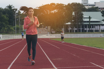 Girl exercise after work evening. sunset