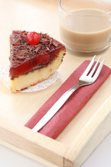 served romantic breakfast for lover: morning  cup of brewed coffee with milk and delicious cherry cheese cake