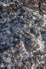 Decorative dark pebbles, like coal, close-up, background, texture. For modern abstract pattern, wallpaper or banner design