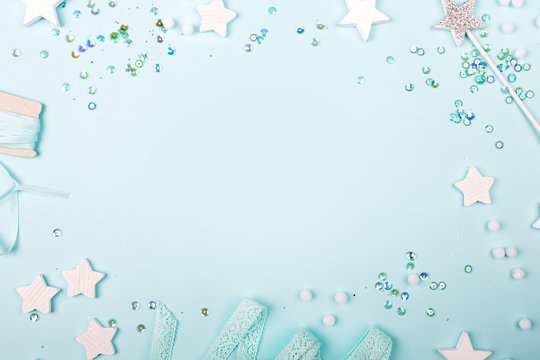 Blue Frame background with stylish decoration stars and sequins with copy space for text.