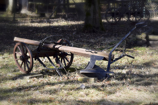 Historical plow in sunshine