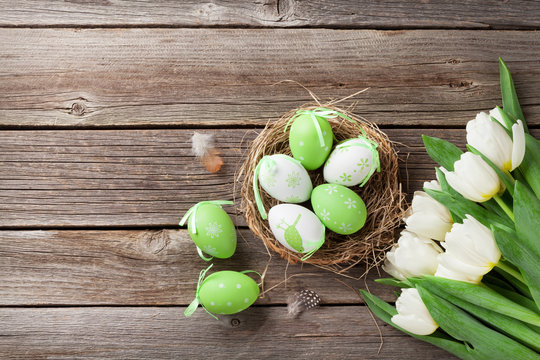 Easter eggs and white tulips