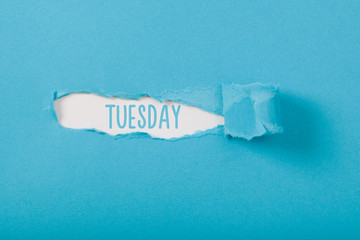 Tuesday, English weekday message on Paper torn ripped opening