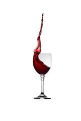 glass of splashing red wine isolated on white