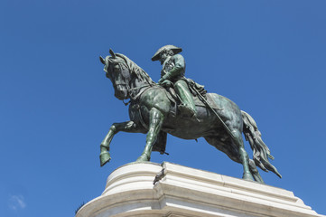 Liberdade square with monument of King Pedro IV statue in foreground and city hall in the top of Aliados Avenue, at Porto city, one of the most popular tourist destinations in Europe.