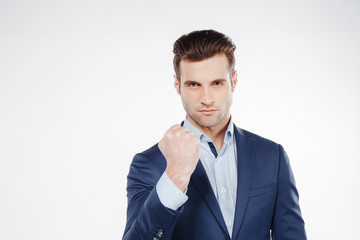 Man in suit showing fist