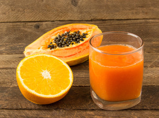 Fresh juice from an orange and papaya.