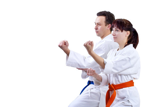 Two adult athlete standing in the rack karate