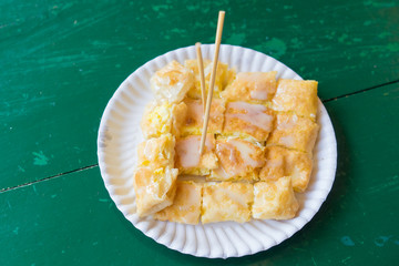 Sweet Roti with milk and sugar on paper plate