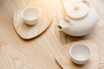 asian tradition white ceramic set on wooden table background with nature light